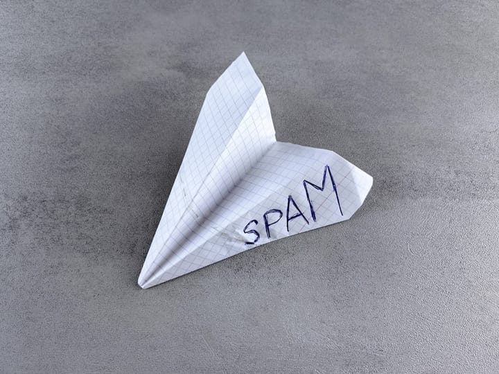 SEO spam - a paper airplane with the word spam written on it